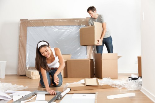 Local moving truck loading furniture and boxes in Barnes