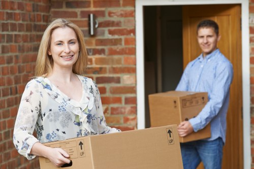 Final stage of a Barnes removals move with boxes entering a new home