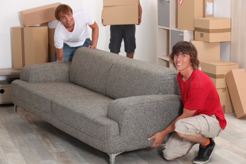 Team handling furniture during a house move in Barnes