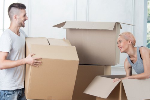 Removal team preparing household items for transport