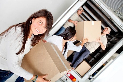 Removal team organising boxes during a local relocation in Barnes