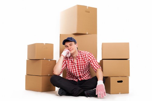 Local removal team handling boxes and furniture in Barnes